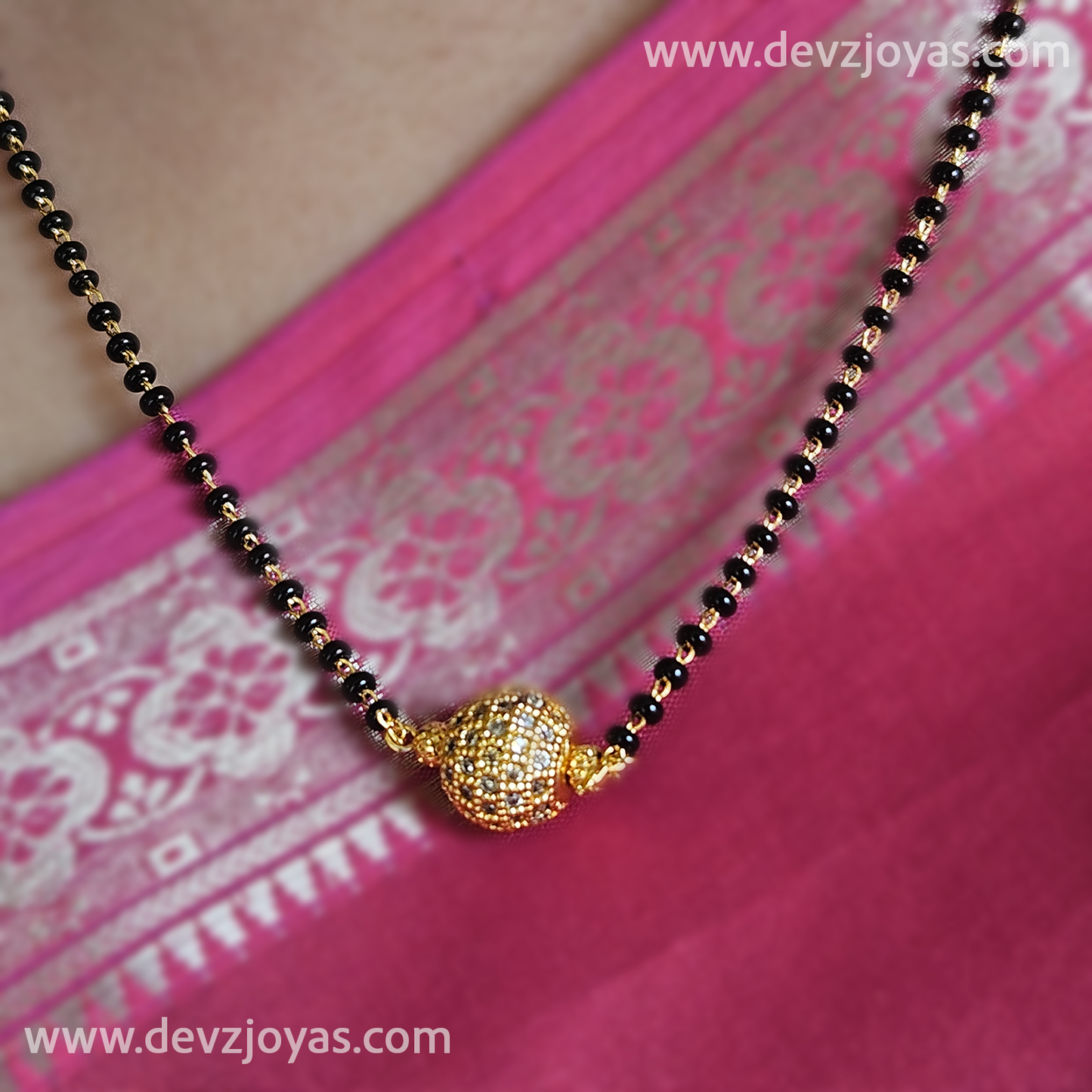 Short chain black bead with globe pendant