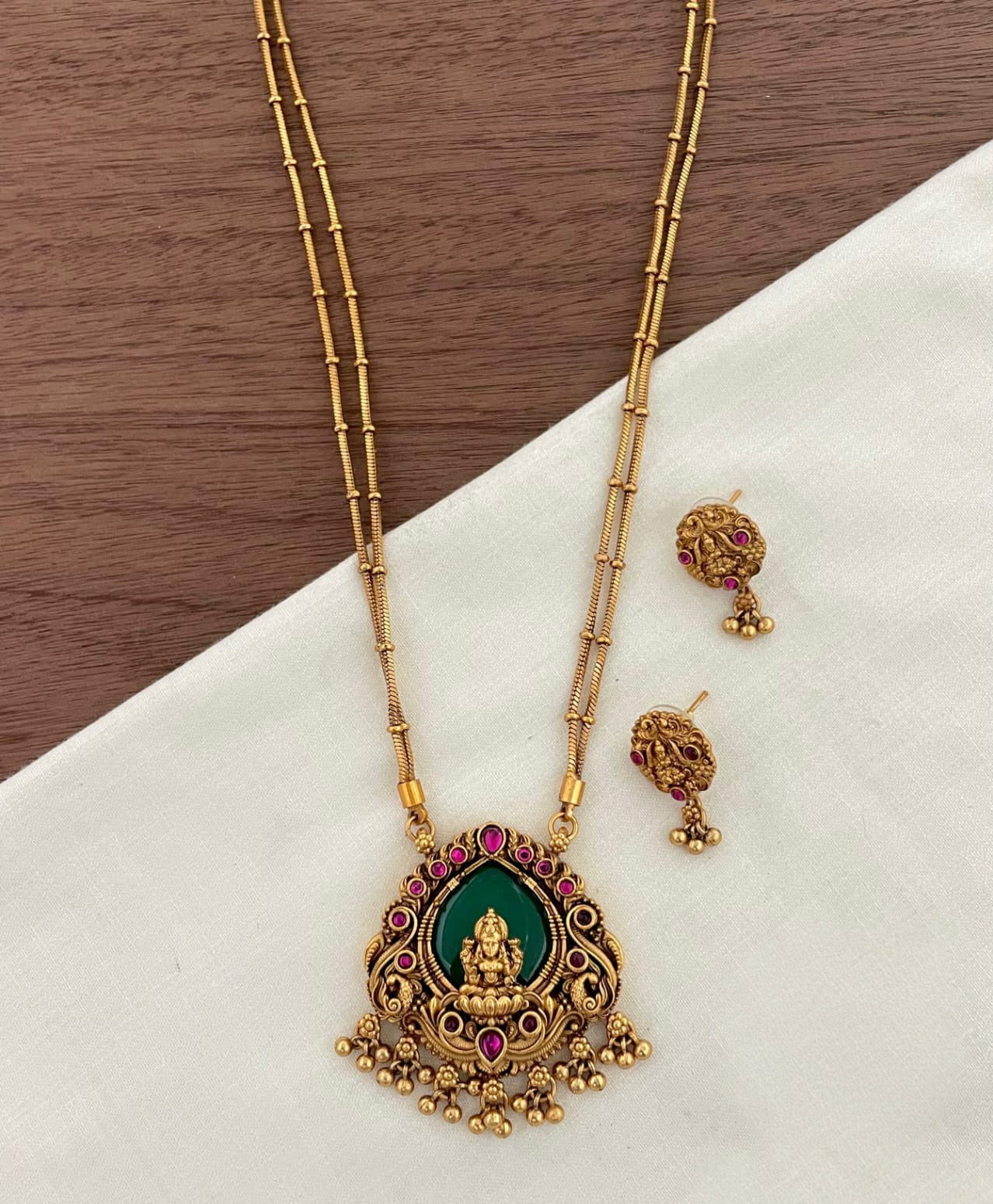 Short haram double layer - lakshmi pendant in green with ruby stones