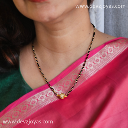 Short chain black bead with globe pendant