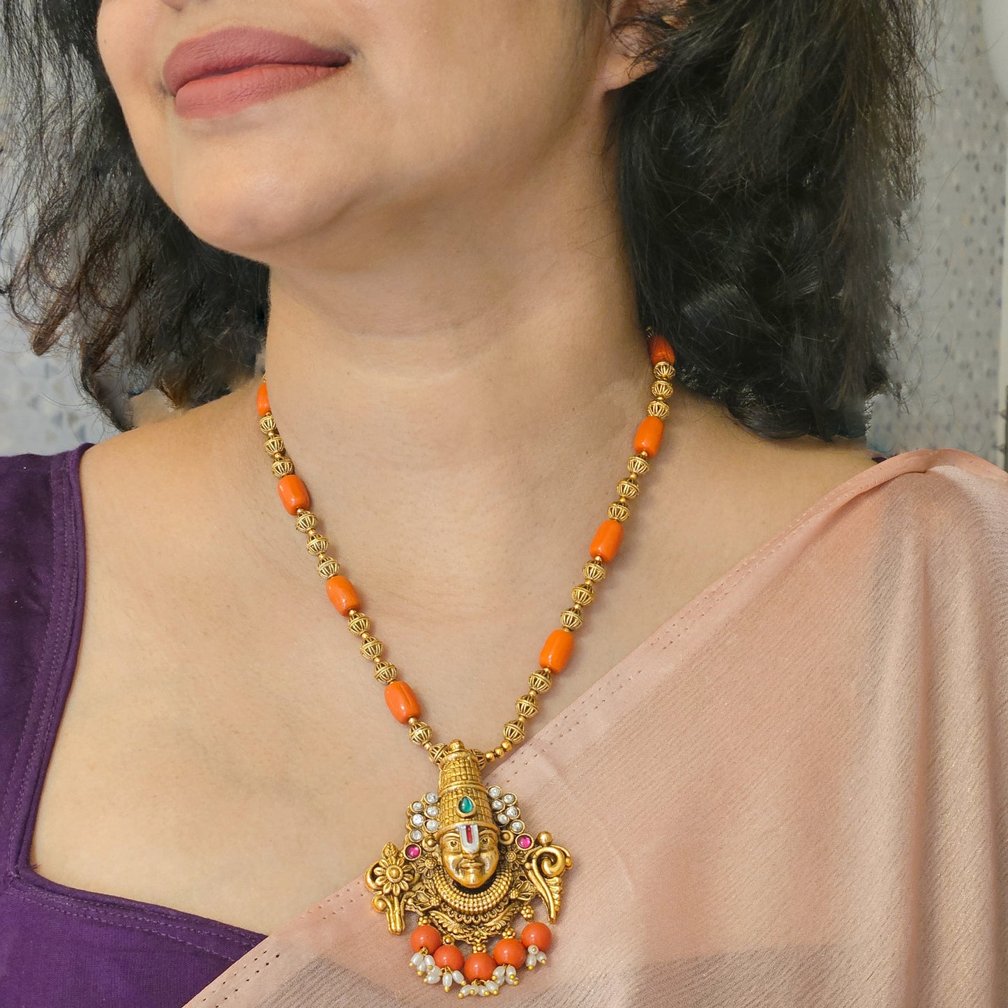 Short haram Venkiteswara with coral beads and earrings