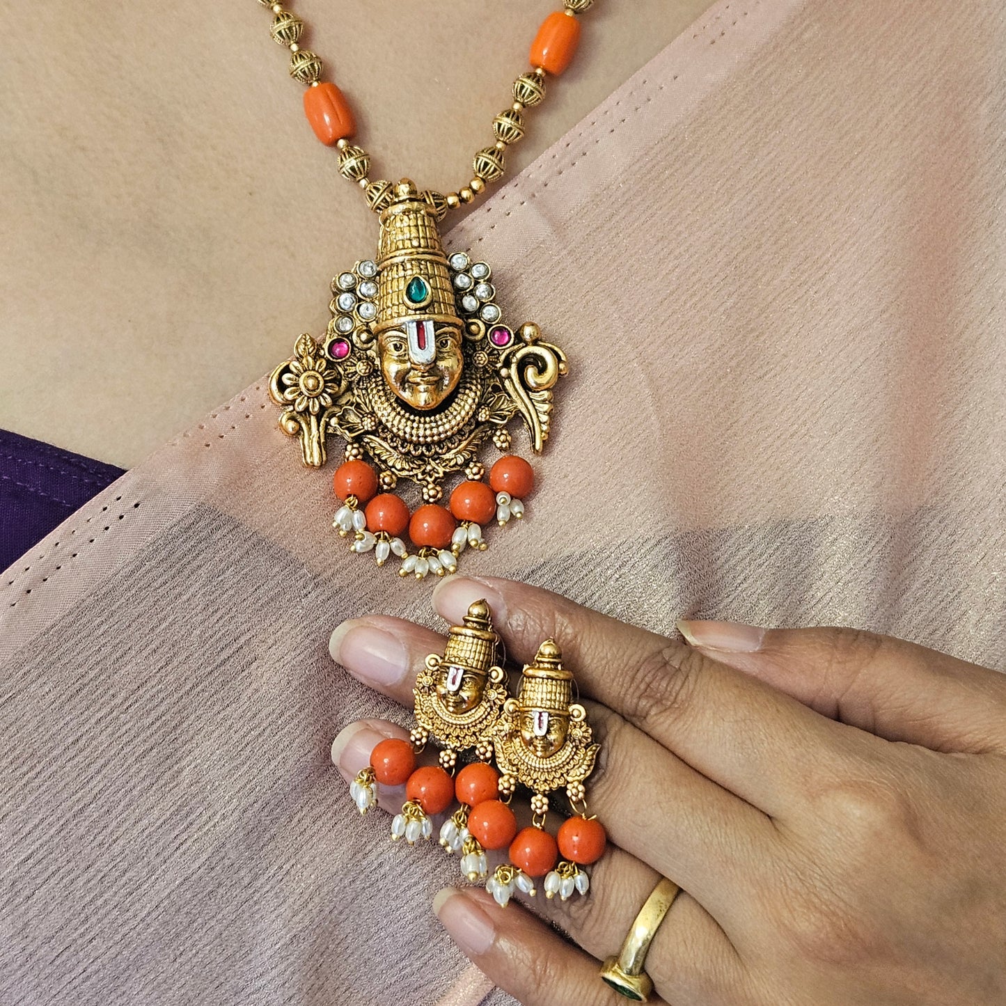 Short haram Venkiteswara with coral beads and earrings