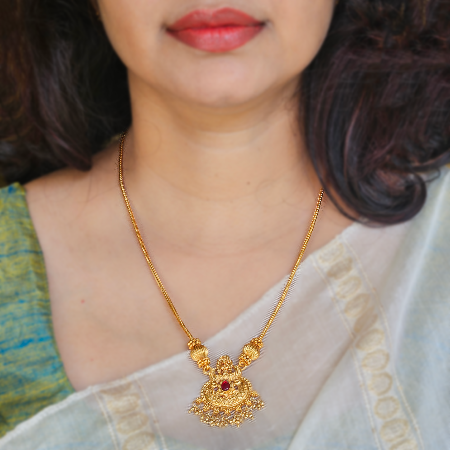 Long chain with Lakshmi pendant