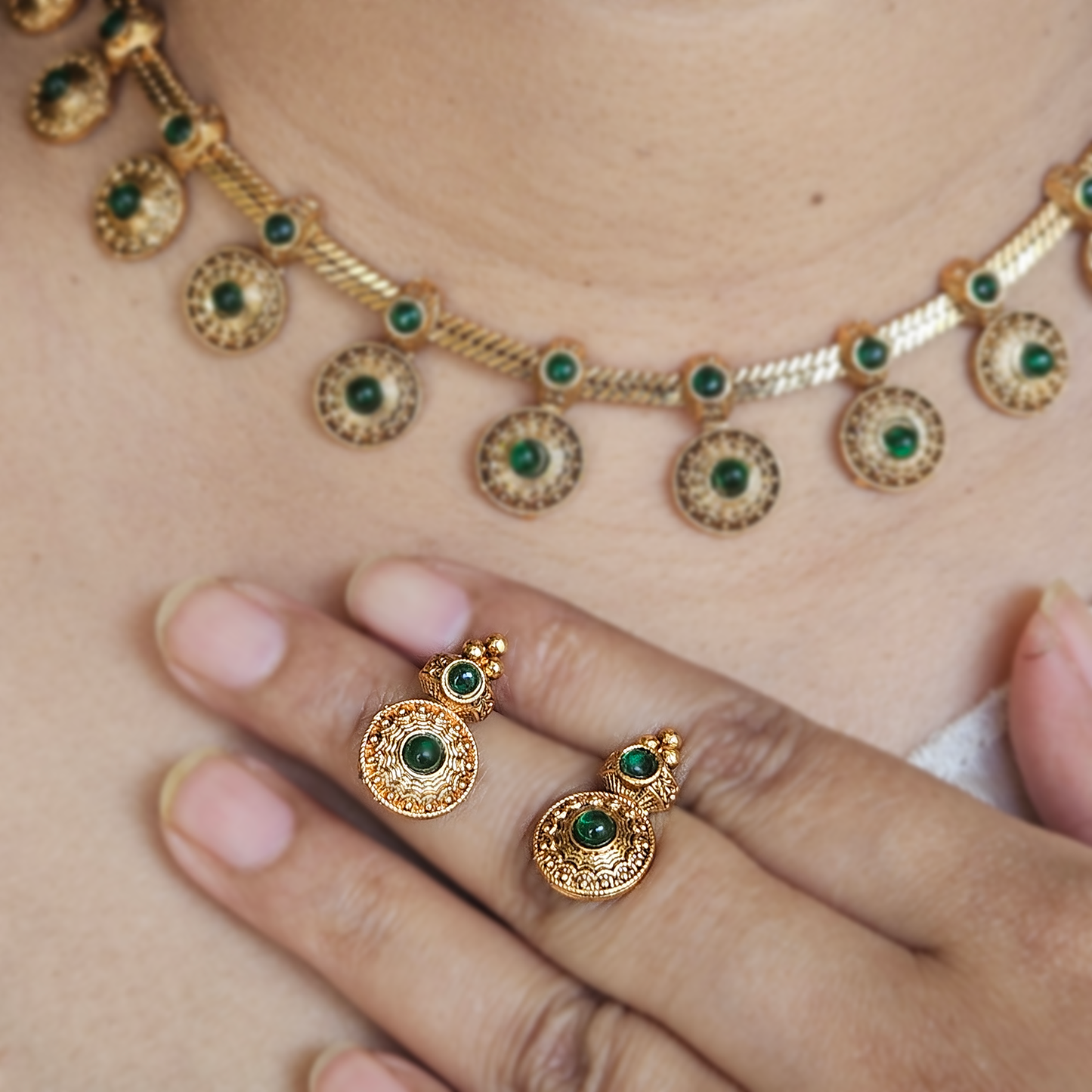 Necklace coin with green stones and studs