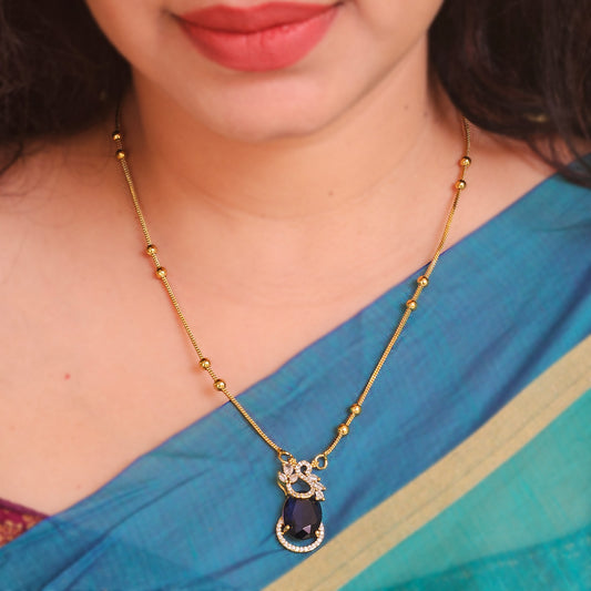 Long chain with peacock pendant violet