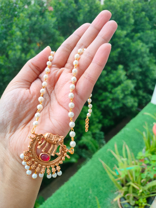 Long pearl chain with elephant pendant