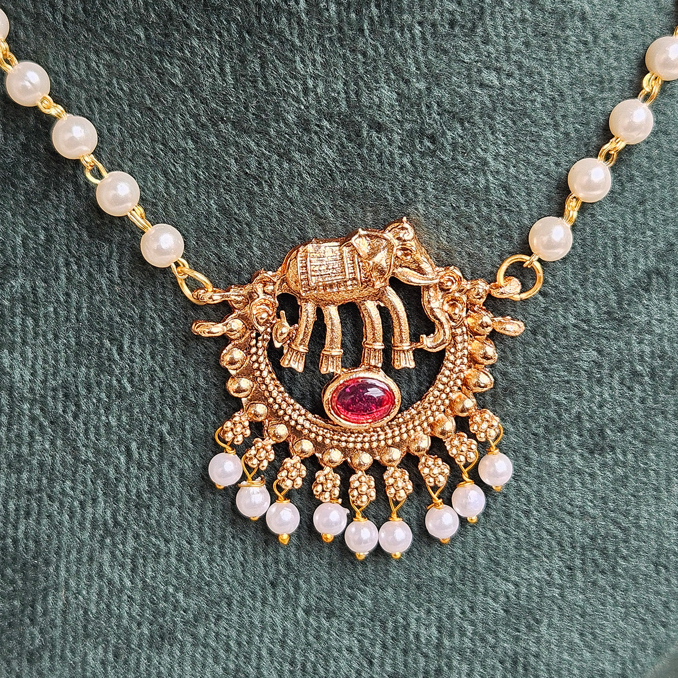 Long pearl chain with elephant pendant