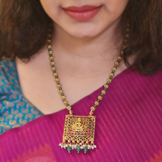 Short haram with golden and green beads