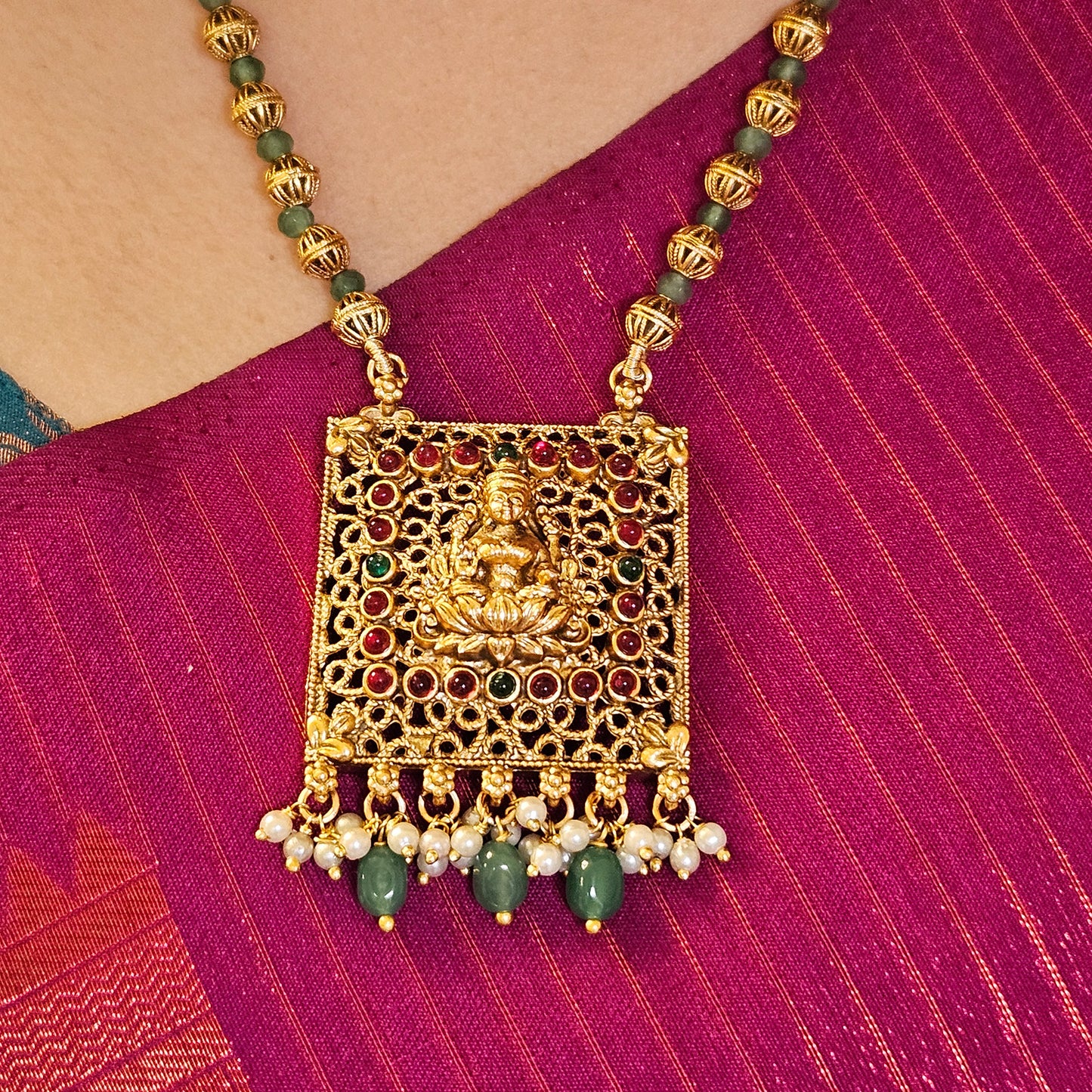 Short haram with golden and green beads